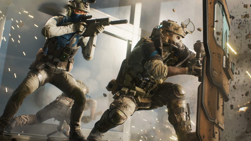 Two soldiers. One armed with a riot shield and the other an SMG.