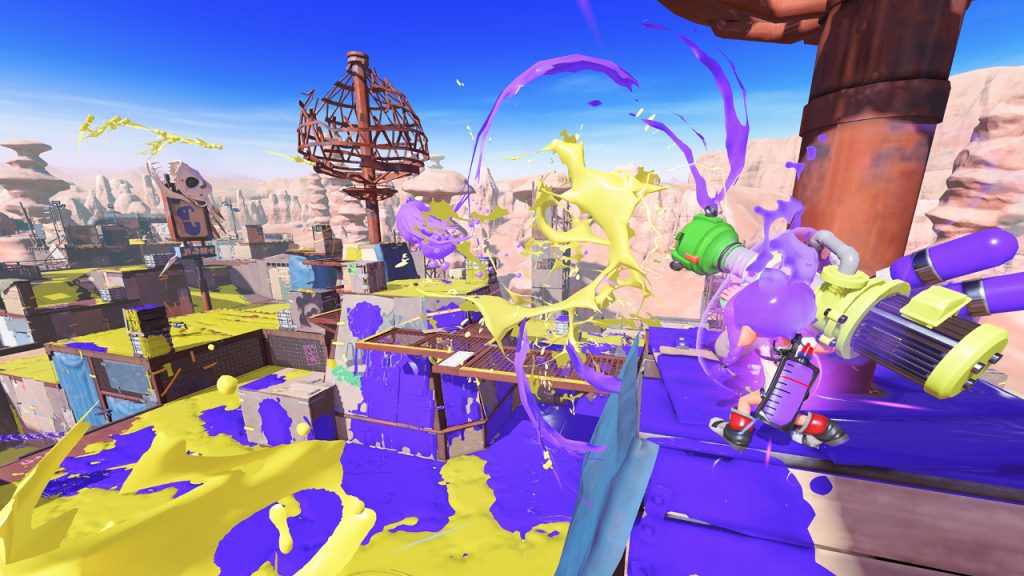 Splatoon 3 Squid fires the Tristrike launcher during a heated turf battle match