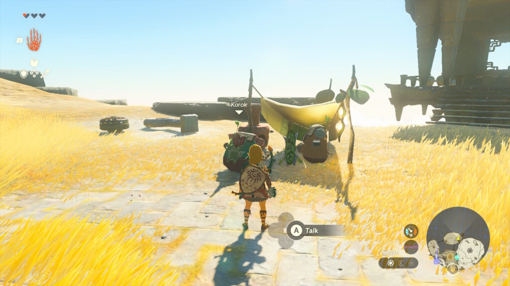 Link and two koroks at camp